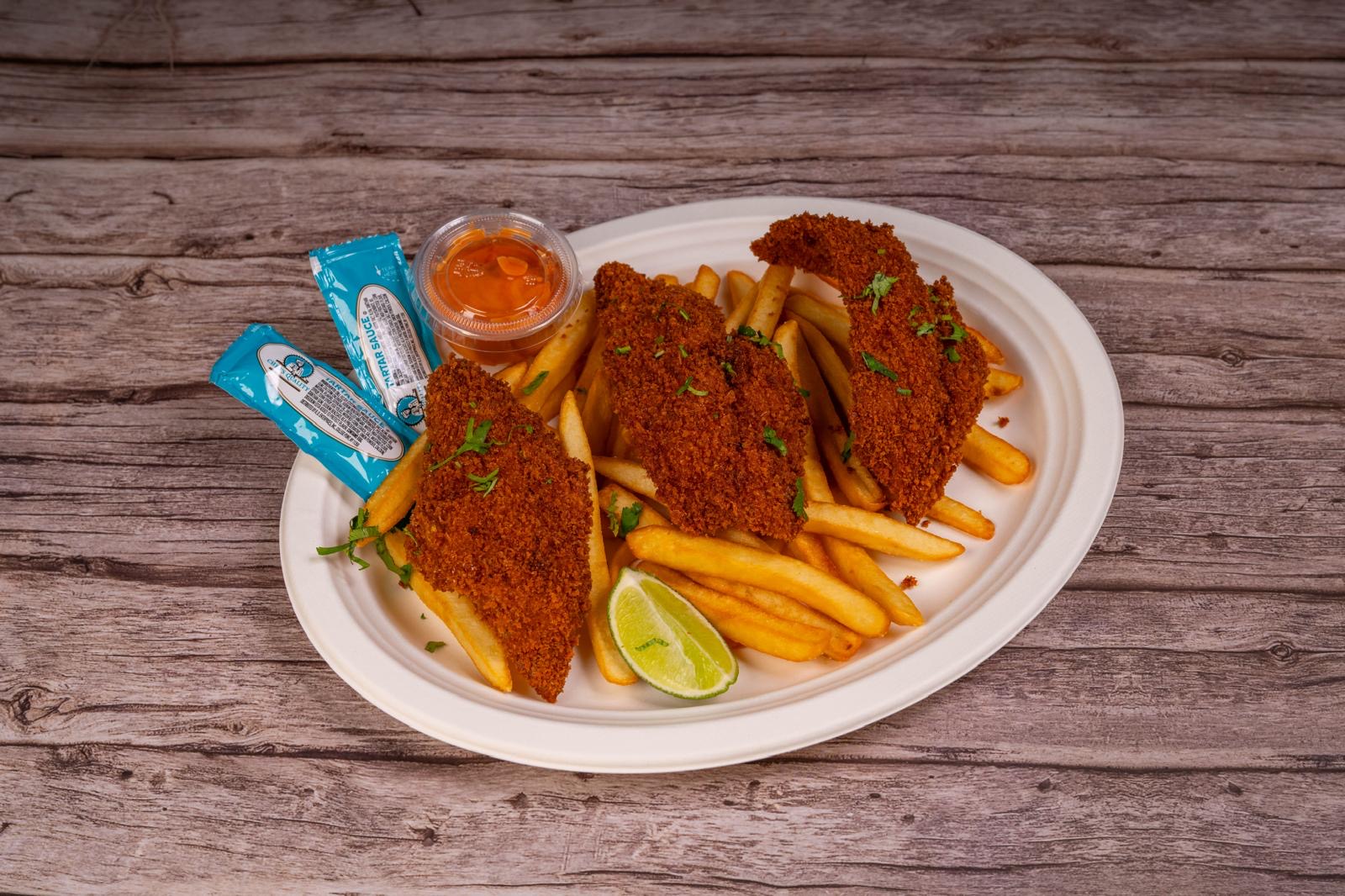 Crispy panko-crusted fish and chips with tartar sauce and lime